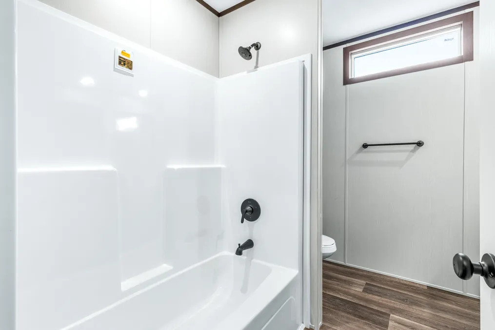 The ABSOLUTE VALUE Guest Bathroom. This Manufactured Mobile Home features 4 bedrooms and 2 baths.