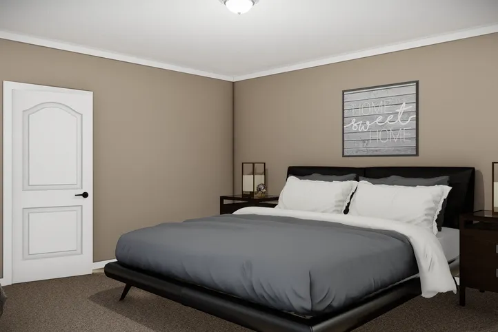 The THE BRYANT Primary Bedroom. This Manufactured Mobile Home features 4 bedrooms and 2 baths.