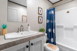 The COLOSSAL Guest Bathroom. This Manufactured Mobile Home features 3 bedrooms and 2 baths.