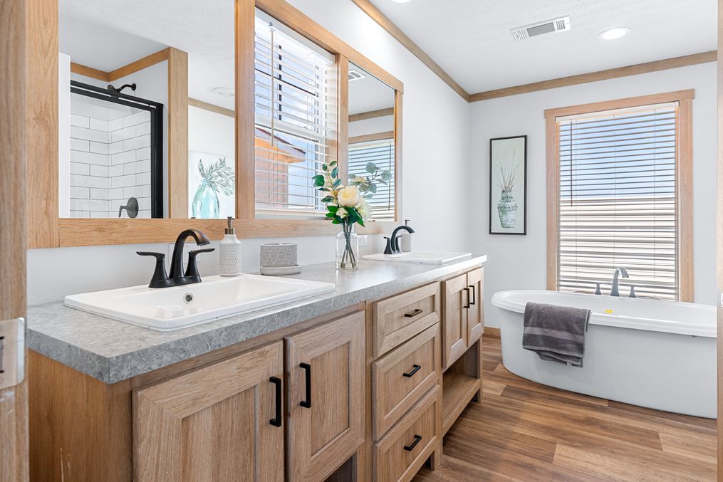 The LORALEI Primary Bathroom. This Manufactured Mobile Home features 3 bedrooms and 2 baths.