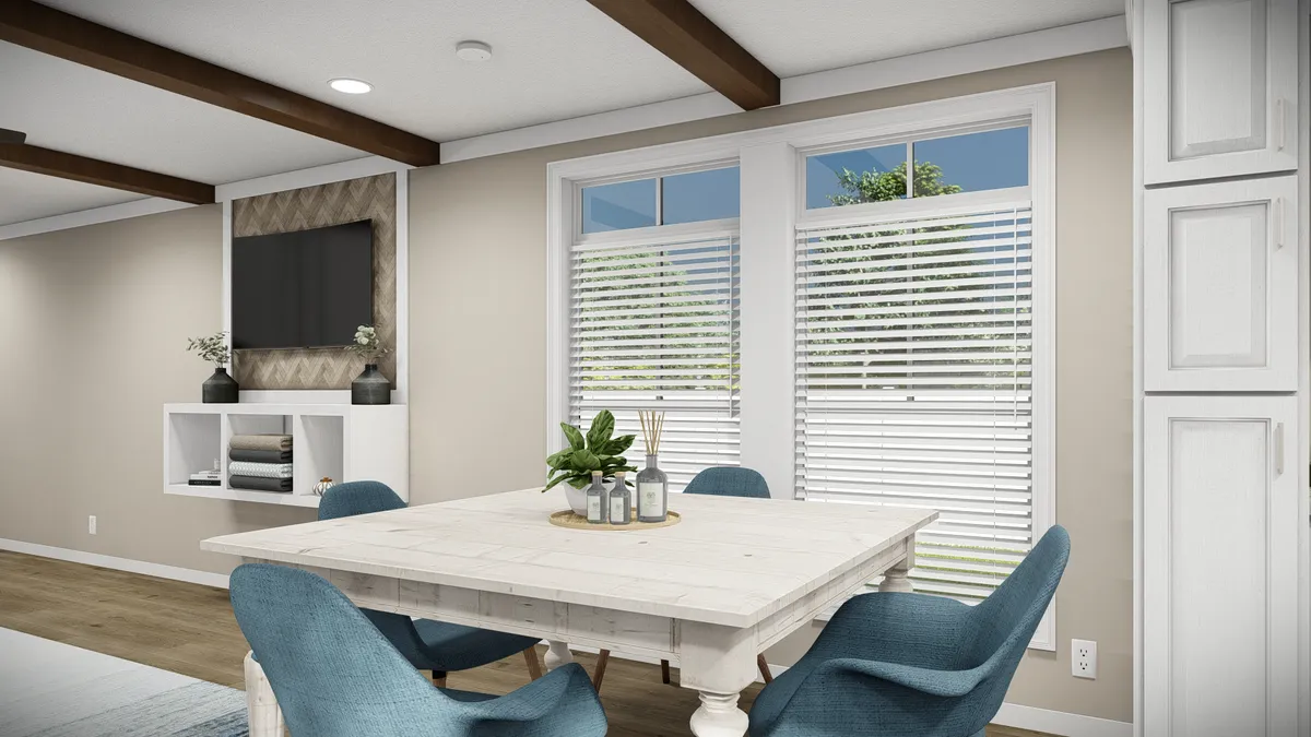 The THE DREAM Dining Area. This Manufactured Mobile Home features 3 bedrooms and 2 baths.