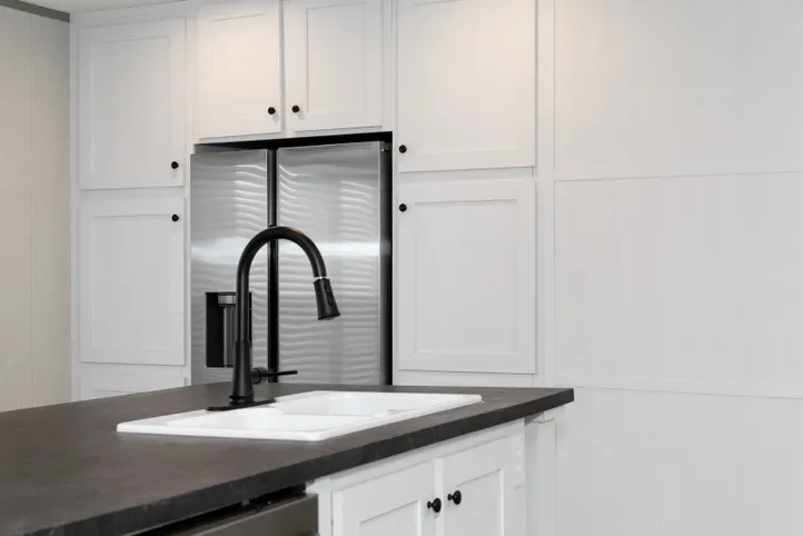 The PLATINUM ANNIVERSARY Kitchen. This Manufactured Mobile Home features 3 bedrooms and 2 baths.