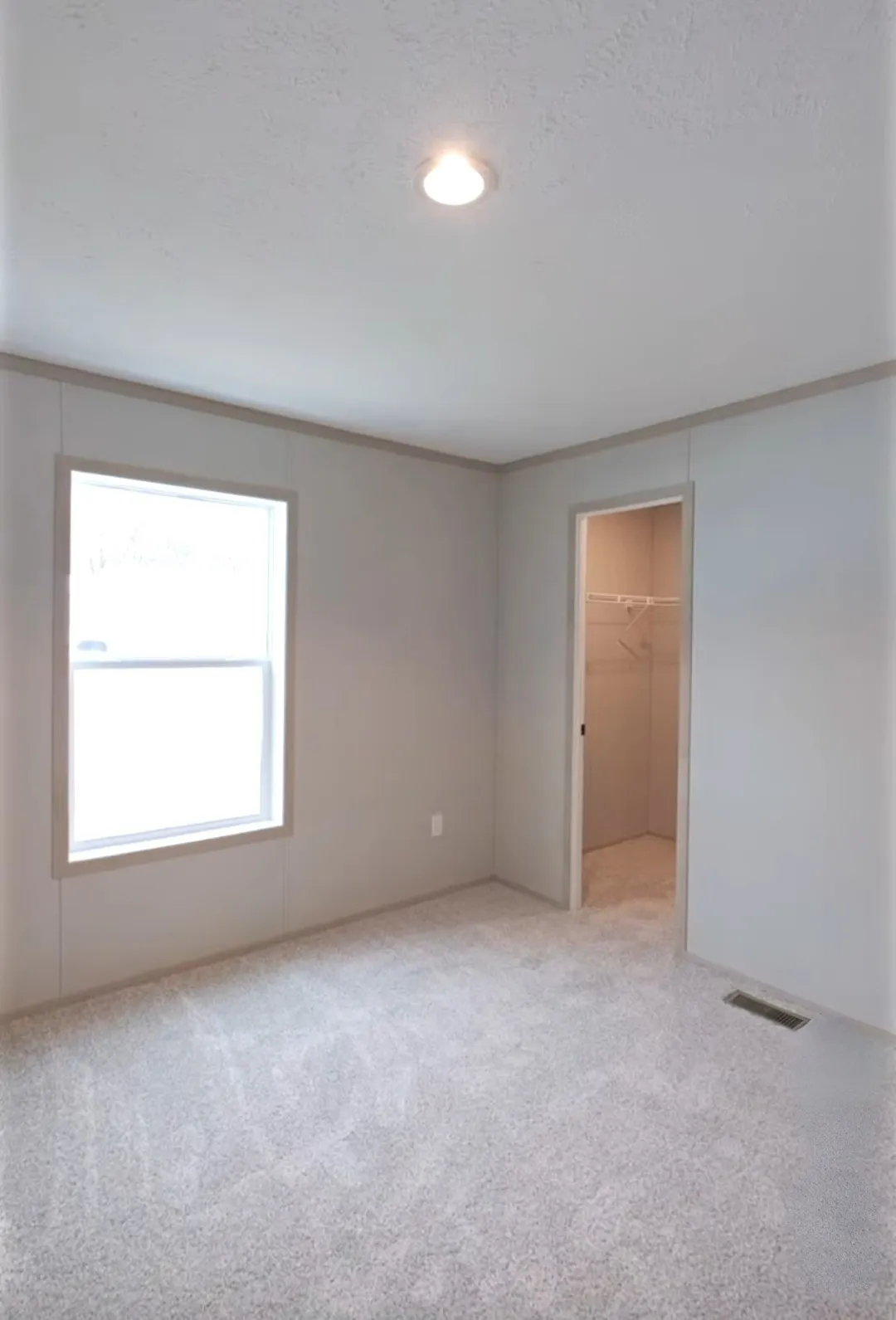 The TURQUOISE Guest Bedroom. This Manufactured Mobile Home features 2 bedrooms and 2 baths.