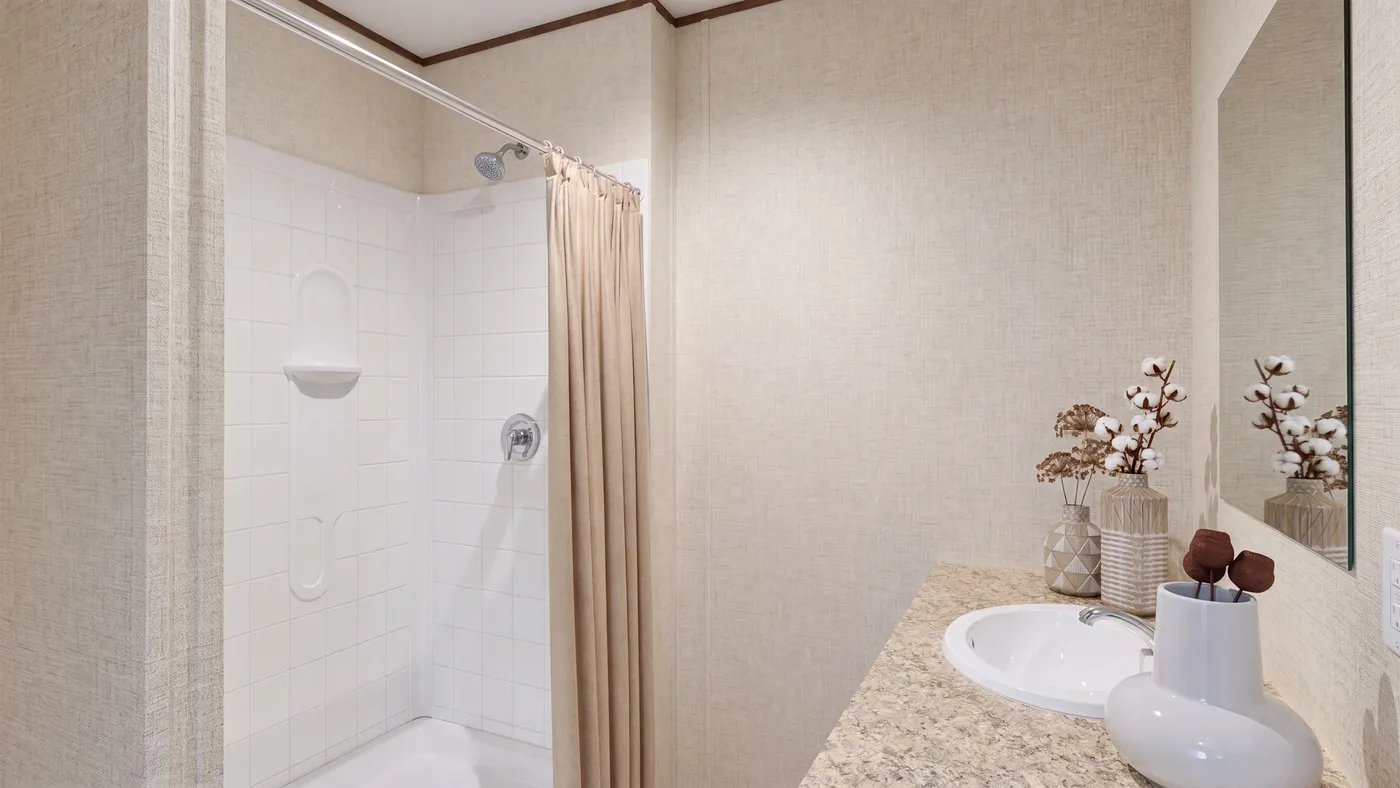 The OAK Primary Bathroom. This Manufactured Mobile Home features 4 bedrooms and 2 baths.