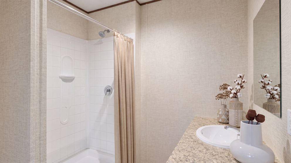 The OAK Primary Bathroom. This Manufactured Mobile Home features 4 bedrooms and 2 baths.