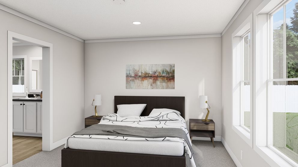 The WHOLE LOTTA LOVE Primary Bedroom. This Manufactured Mobile Home features 3 bedrooms and 2 baths.