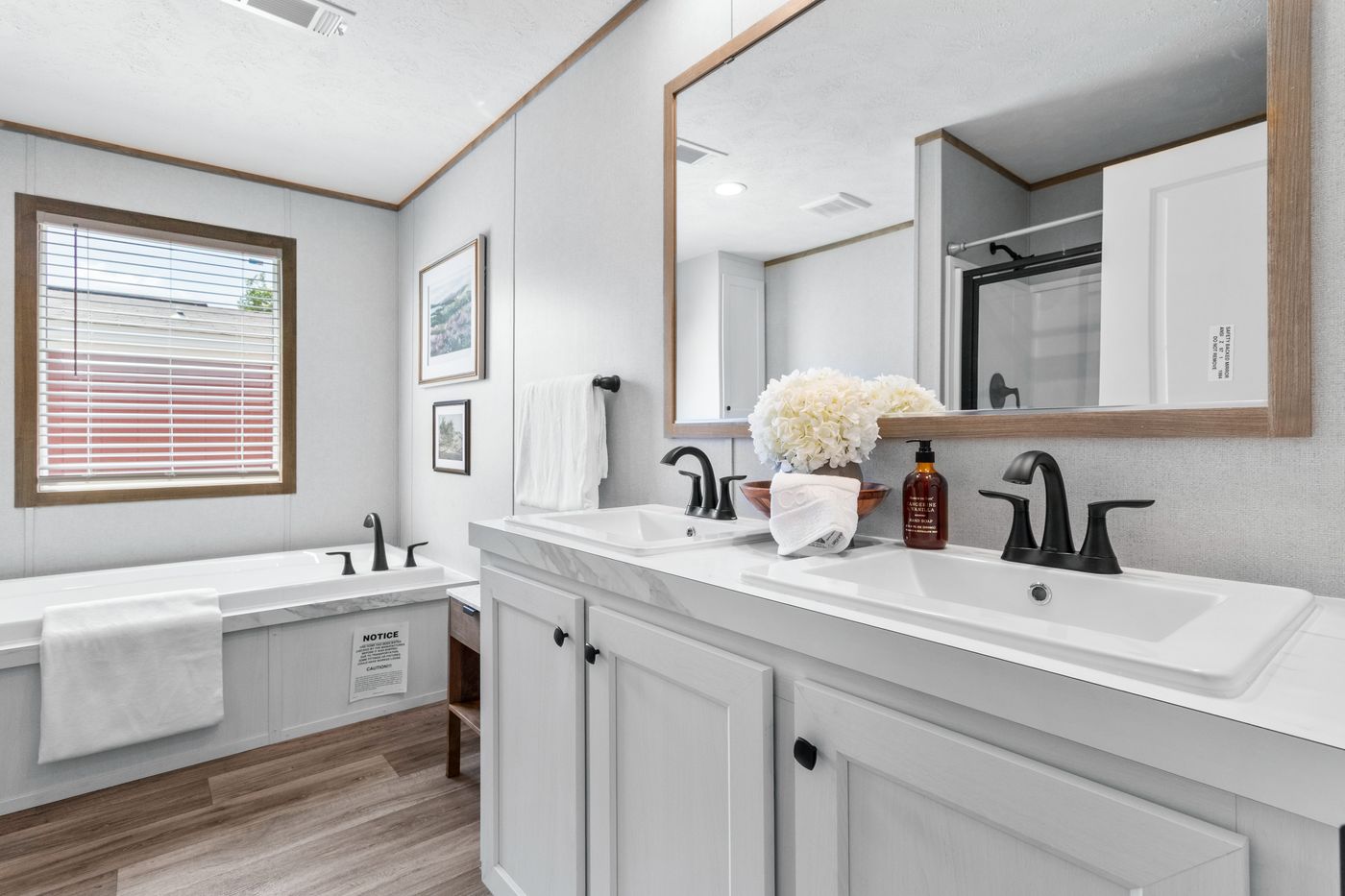 The THE REAL DEAL Primary Bathroom. This Manufactured Mobile Home features 3 bedrooms and 2 baths.