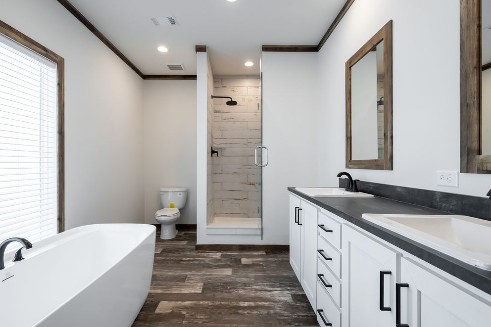 The 3237 THE TYBEE HUD Primary Bathroom. This Manufactured Mobile Home features 4 bedrooms and 3 baths.