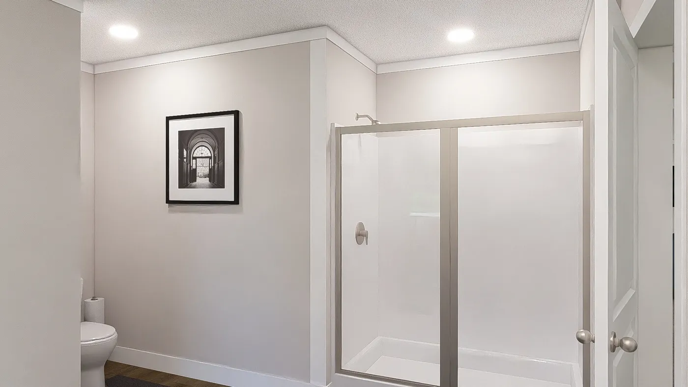 The WONDERFUL WORLD Primary Bathroom. This Manufactured Mobile Home features 3 bedrooms and 2 baths.