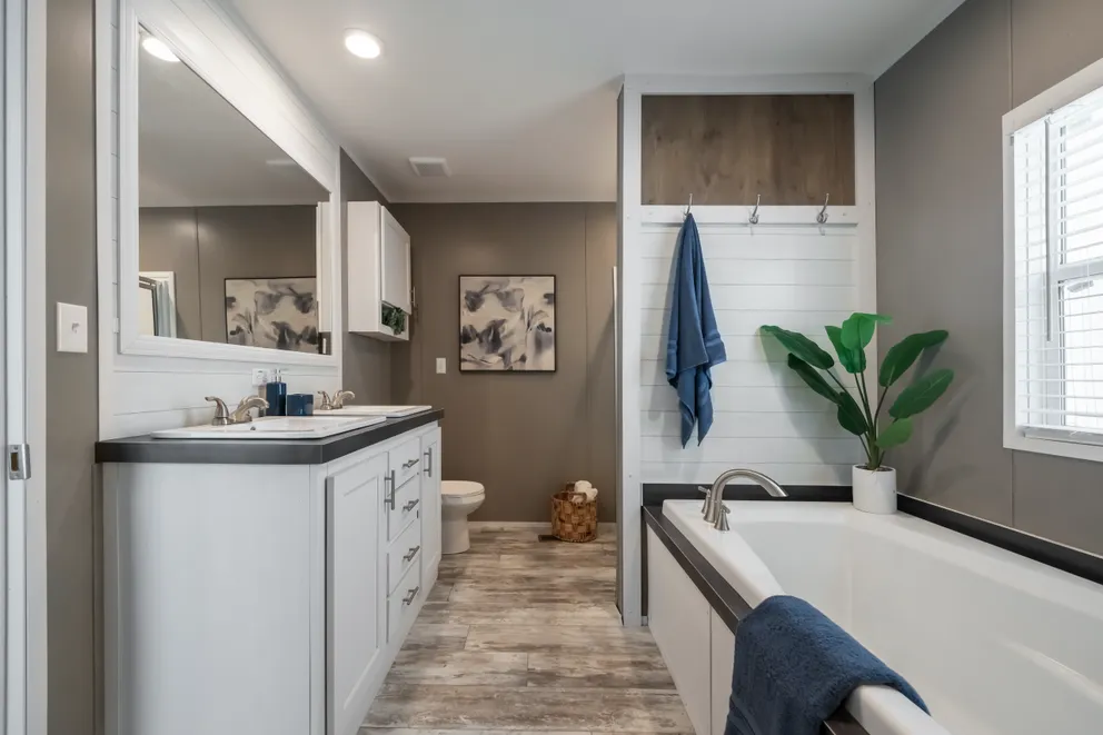 The LIBERTY Primary Bathroom. This Manufactured Mobile Home features 3 bedrooms and 2 baths.