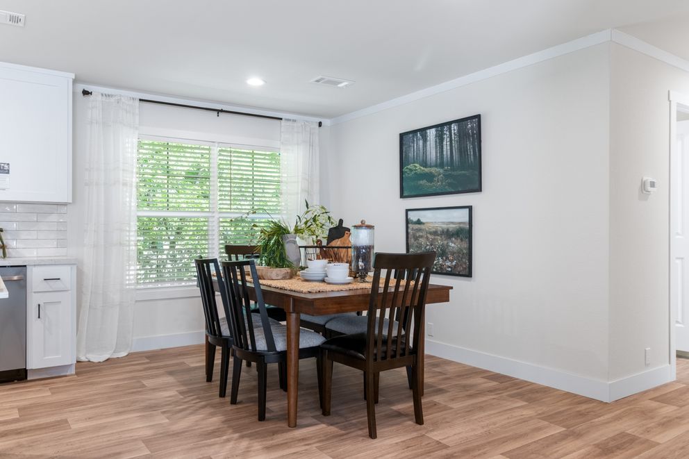 The FARM 4 FLEX ELITE Dining Room. This Manufactured Mobile Home features 4 bedrooms and 3 baths.
