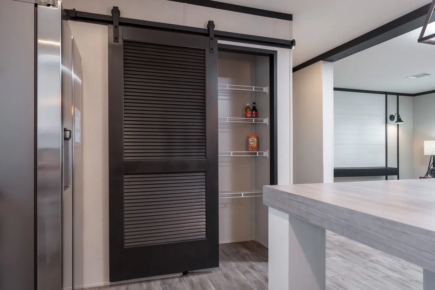 The BREEZE FARMHOUSE Kitchen. This Manufactured Mobile Home features 3 bedrooms and 2 baths.