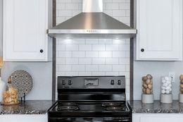 The THE SHOWER HOUSE 2.0 Kitchen. This Manufactured Mobile Home features 3 bedrooms and 2 baths.