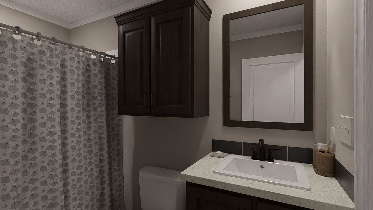 The THE LIL' EASY Guest Bathroom. This Manufactured Mobile Home features 3 bedrooms and 2 baths.