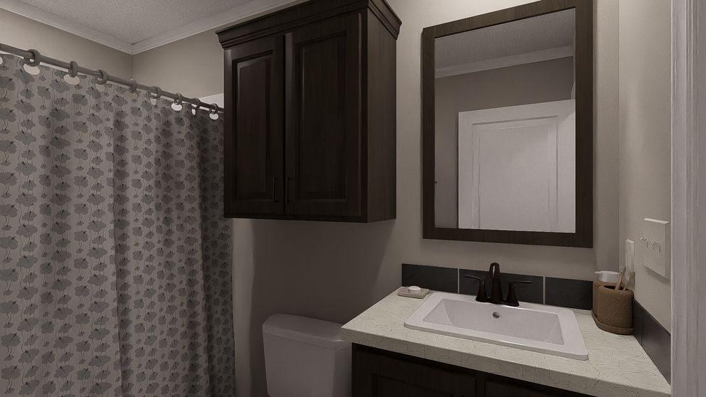 The THE LIL' EASY Guest Bathroom. This Manufactured Mobile Home features 3 bedrooms and 2 baths.