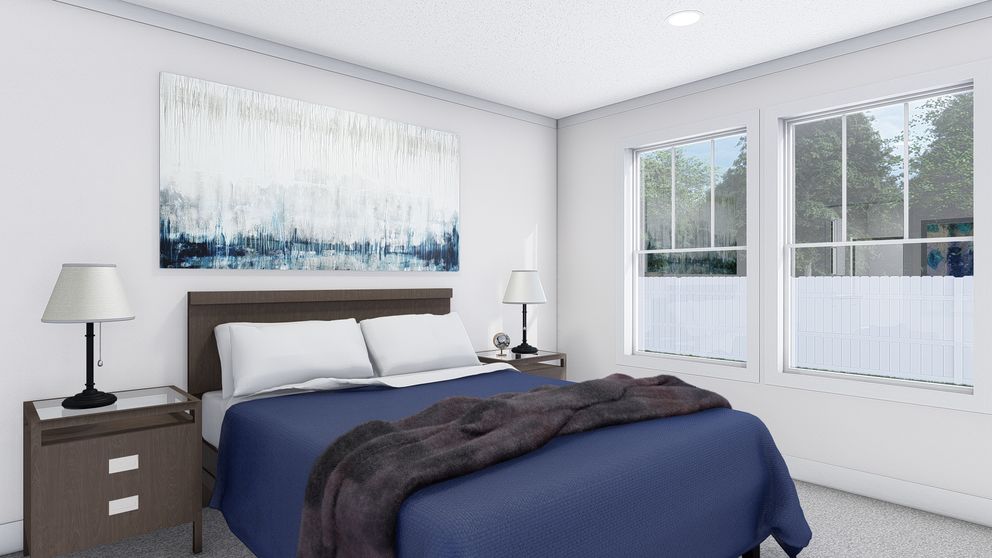 The JOHNNY B GOODE Primary Bedroom. This Manufactured Mobile Home features 3 bedrooms and 2 baths.