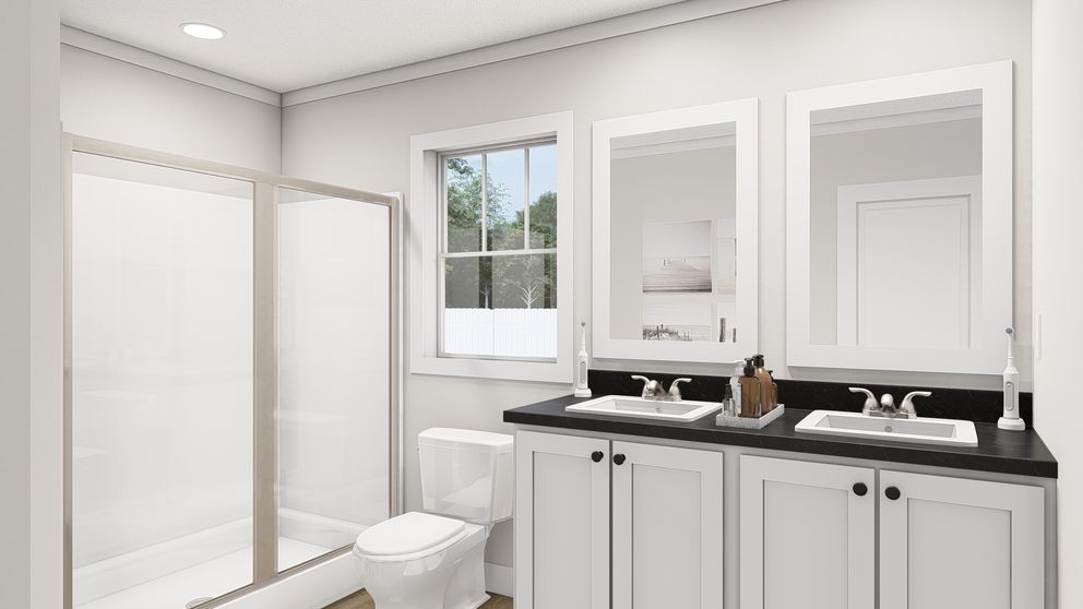 The WHOLE LOTTA LOVE Primary Bathroom. This Manufactured Mobile Home features 3 bedrooms and 2 baths.