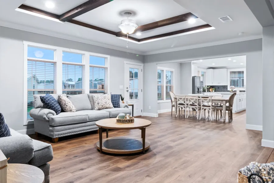 The THE OLYMPUS Living Room. This Manufactured Mobile Home features 4 bedrooms and 3 baths.