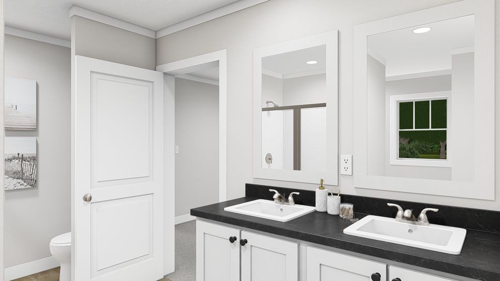 The SHOUT Primary Bathroom. This Manufactured Mobile Home features 3 bedrooms and 2 baths.