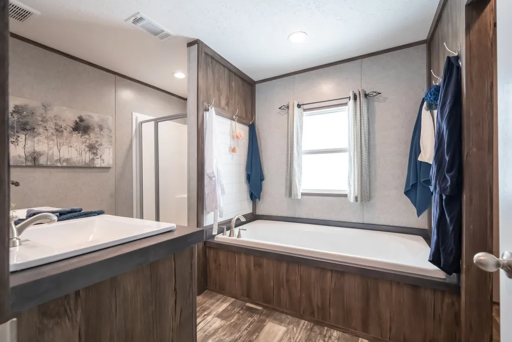 The LIBERTY Primary Bathroom. This Manufactured Mobile Home features 3 bedrooms and 2 baths.