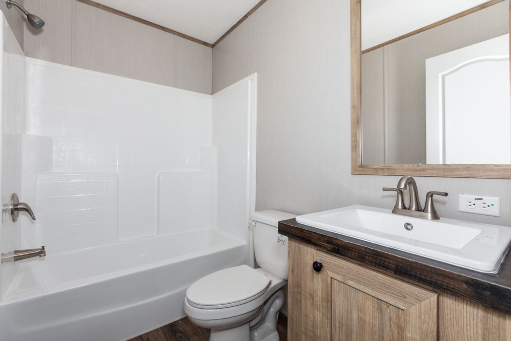 The REVOLUTION 76A Guest Bathroom. This Manufactured Mobile Home features 3 bedrooms and 2 baths.
