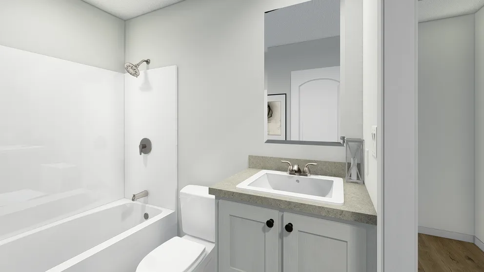 The MOVE ON UP Guest Bathroom. This Manufactured Mobile Home features 3 bedrooms and 2 baths.