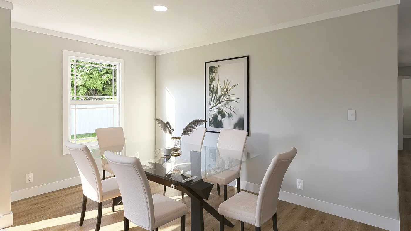 The THE BREEZE 64 Dining Area. This Manufactured Mobile Home features 4 bedrooms and 2 baths.