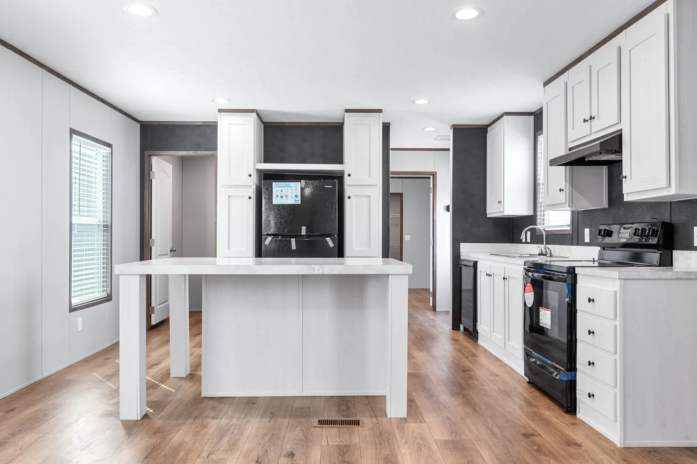 The HOMESTEAD 16602A Kitchen. This Manufactured Mobile Home features 2 bedrooms and 2 baths.
