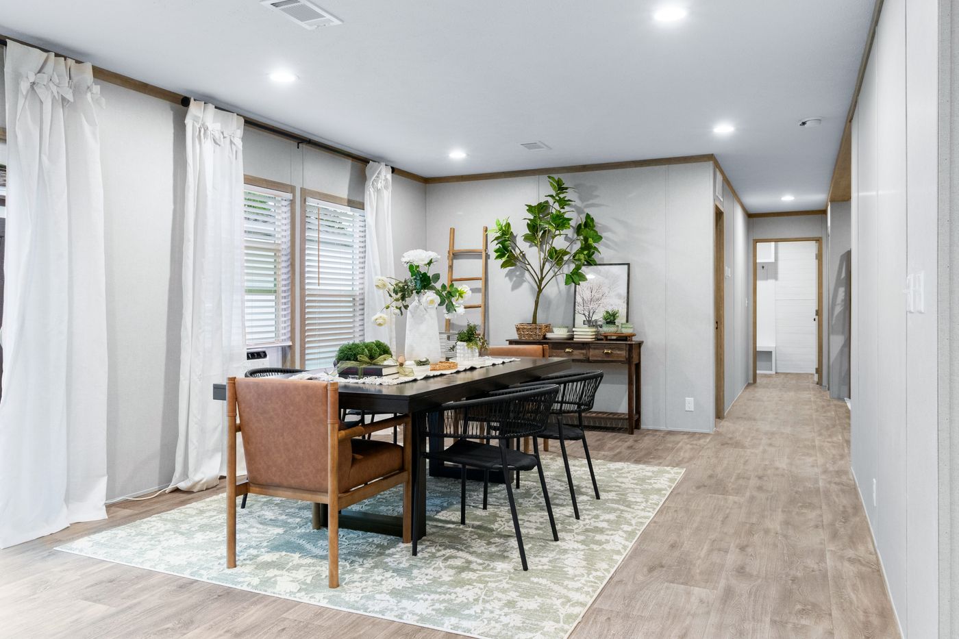 The EL SUENO BREEZE Dining Area. This Manufactured Mobile Home features 4 bedrooms and 2 baths.