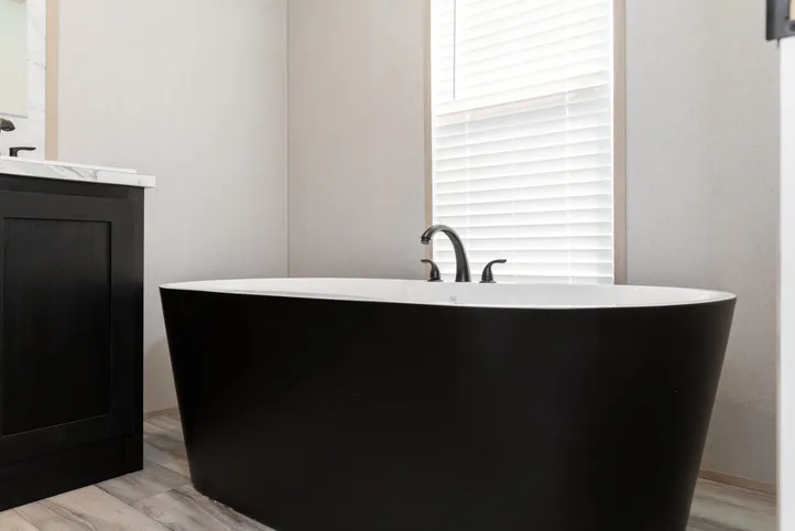 The THE ANNIVERSARY ISLANDER Primary Bathroom. This Manufactured Mobile Home features 3 bedrooms and 2 baths.