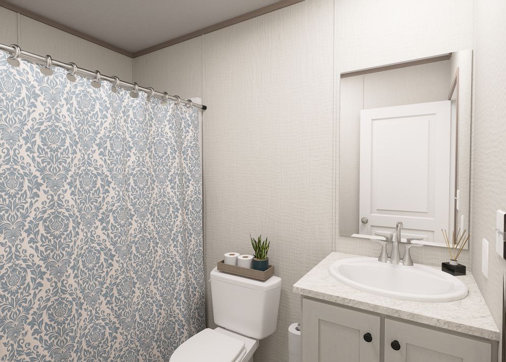 The FLEX COASTAL BREEZE Guest Bathroom. This Manufactured Mobile Home features 3 bedrooms and 2 baths.