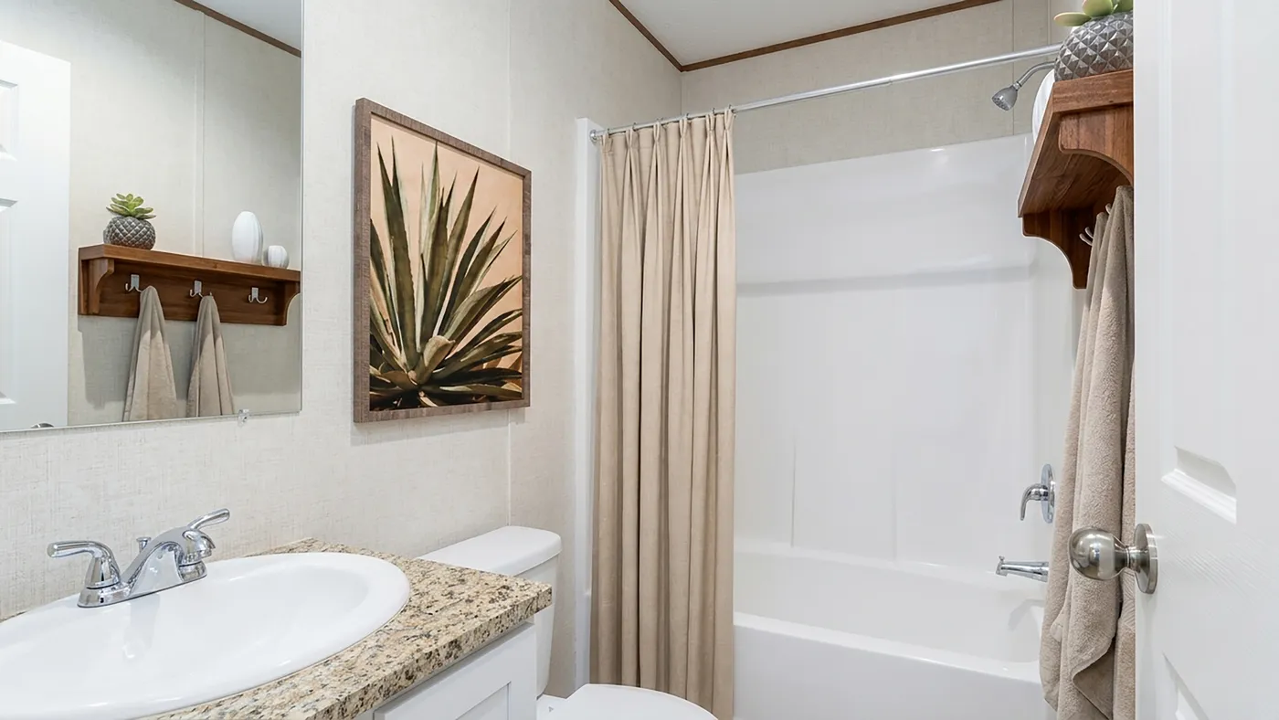 The MAPLE Guest Bathroom. This Manufactured Mobile Home features 3 bedrooms and 2 baths.