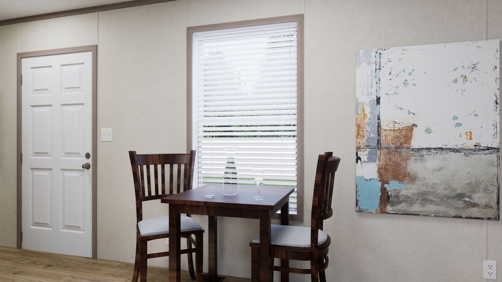 The 4816-CC05 OASIS 48 Dining Area. This Manufactured Mobile Home features 2 bedrooms and 1 bath.