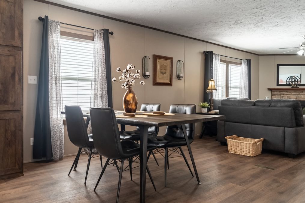 The ULTRA EXCEL 4 BR 28X68 Dining Area. This Manufactured Mobile Home features 4 bedrooms and 2 baths.
