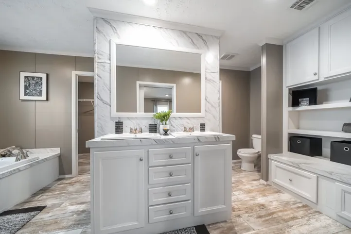 The CASCADE Primary Bathroom. This Manufactured Mobile Home features 4 bedrooms and 2 baths.