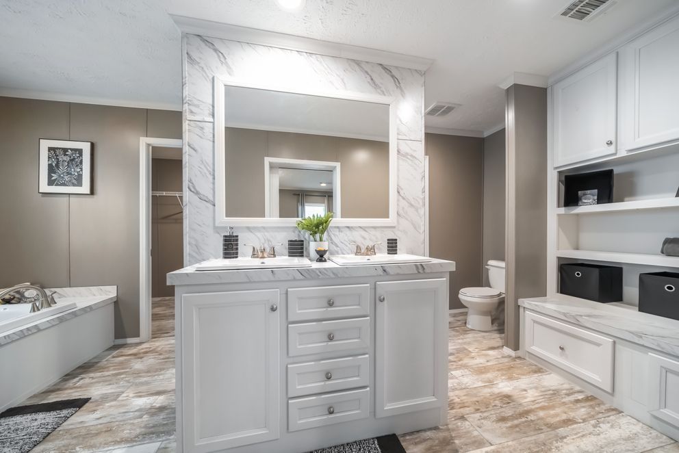 The CASCADE Primary Bathroom. This Manufactured Mobile Home features 4 bedrooms and 2 baths.