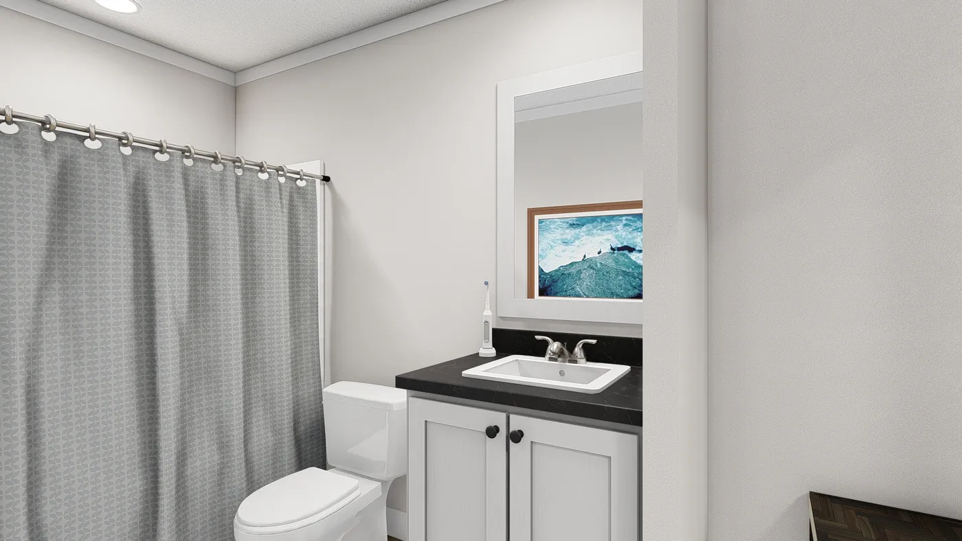 The THREE LITTLE BIRDS Guest Bathroom. This Manufactured Mobile Home features 3 bedrooms and 2 baths.