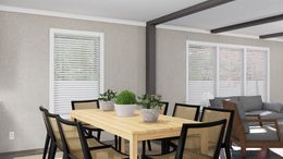 The THE FUSION 32H Dining Area. This Manufactured Mobile Home features 5 bedrooms and 3 baths.