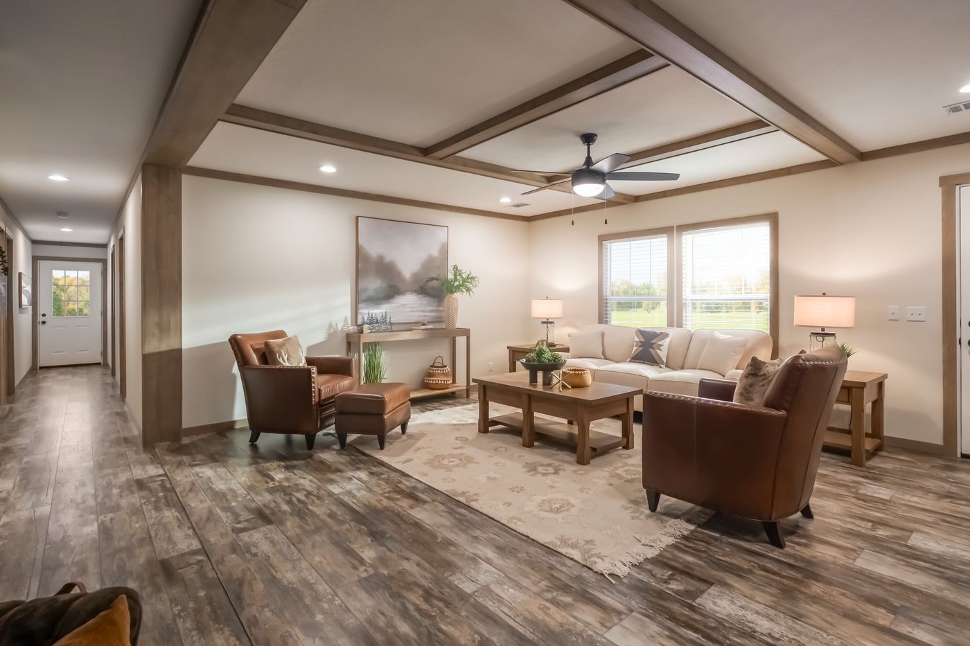The BOUJEE PREMIER Living Room. This Manufactured Mobile Home features 4 bedrooms and 2 baths.