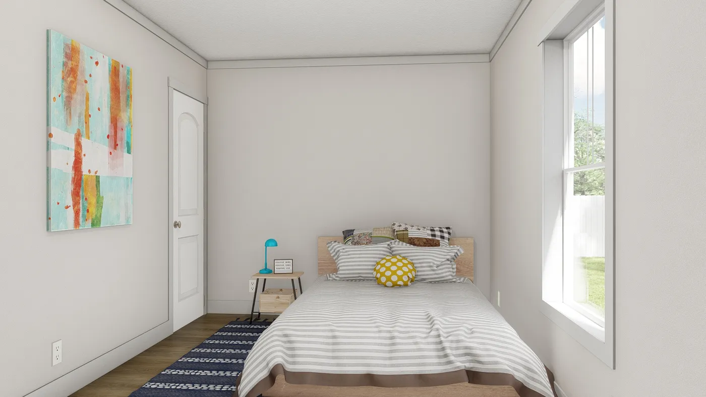 The MOVE ON UP Guest Bedroom. This Manufactured Mobile Home features 3 bedrooms and 2 baths.