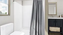 The COOK Primary Bathroom. This Manufactured Mobile Home features 3 bedrooms and 2 baths.