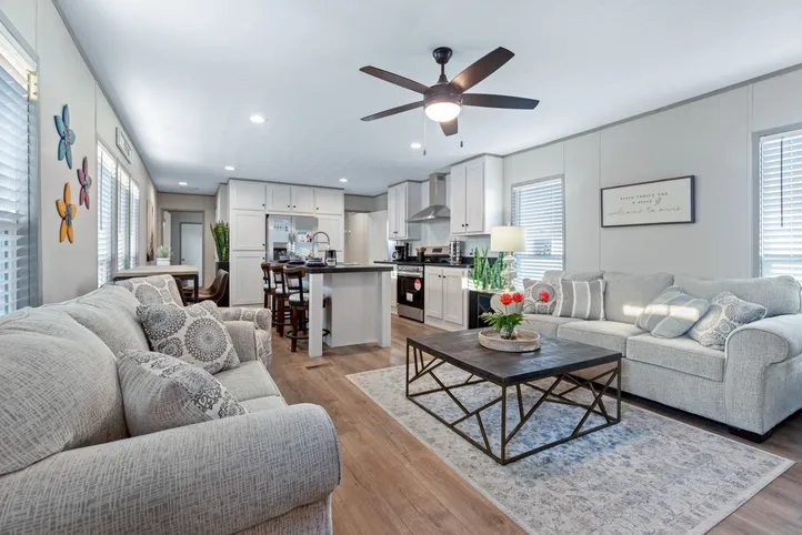 The RESOLUTION 16763X Living Room. This Manufactured Mobile Home features 3 bedrooms and 2 baths.