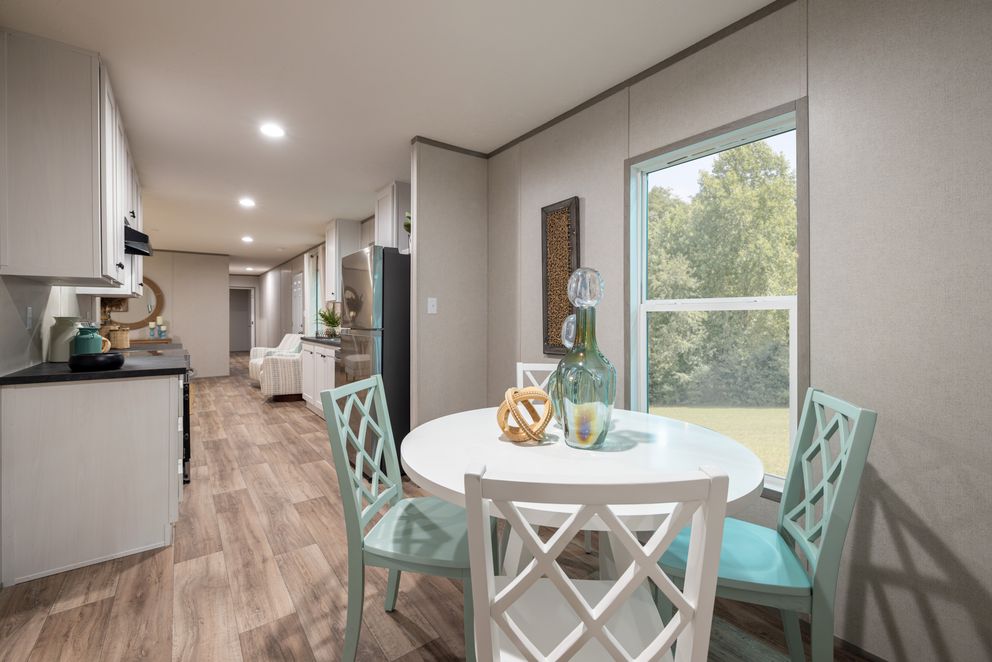 The HORIZON NORTHSTAR 16763A Dining Area. This Manufactured Mobile Home features 3 bedrooms and 2 baths.