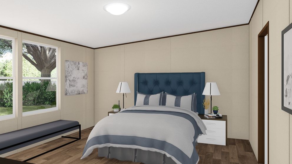 The MARVELOUS 3 Primary Bedroom. This Manufactured Mobile Home features 3 bedrooms and 2 baths.