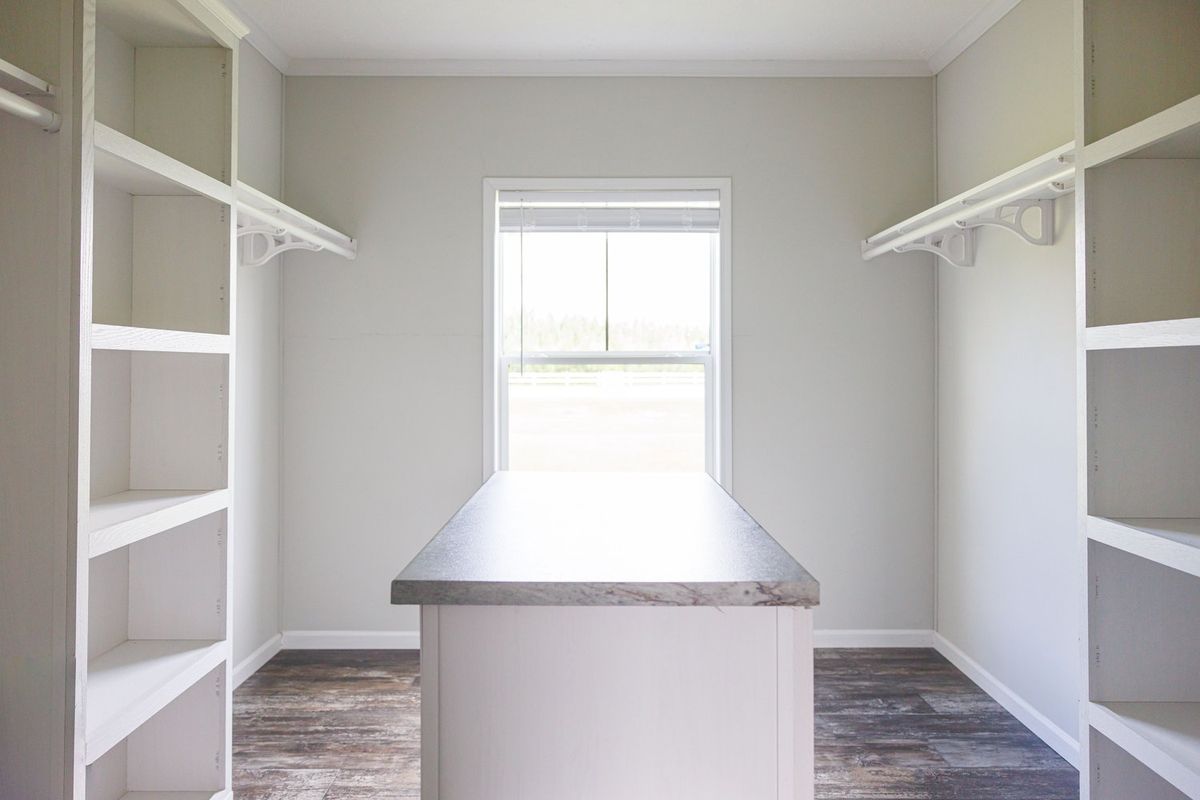 The THE BRYANT Storage. This Manufactured Mobile Home features 4 bedrooms and 2 baths.