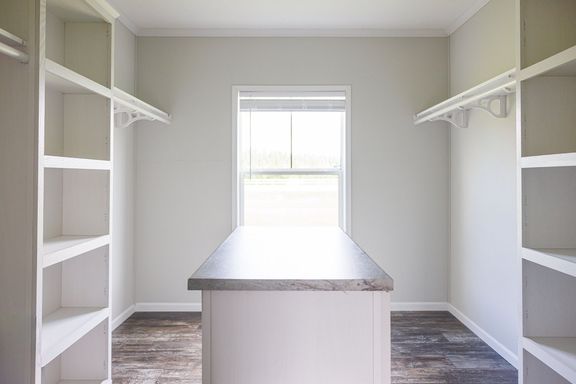 The THE BRYANT Storage. This Manufactured Mobile Home features 4 bedrooms and 2 baths.