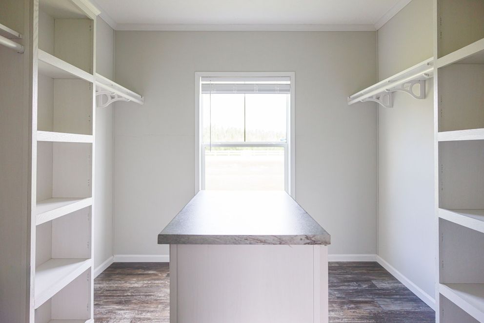 The THE BRYANT Storage. This Manufactured Mobile Home features 4 bedrooms and 2 baths.