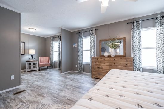 The CASCADE Primary Bedroom. This Manufactured Mobile Home features 4 bedrooms and 2 baths.
