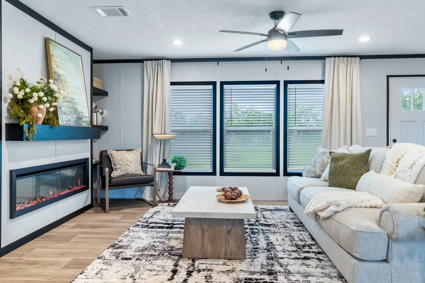 The ODYSSEY Living Room. This Manufactured Mobile Home features 4 bedrooms and 2 baths.
