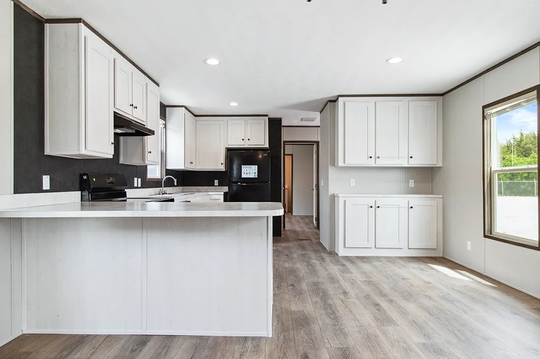 The HOMESTEAD 16562A Kitchen. This Manufactured Mobile Home features 2 bedrooms and 2 baths.